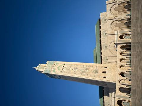 The Hassan II Mosque with a clear blue sky.