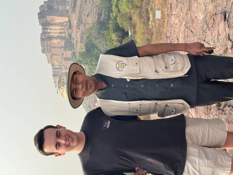 Two men standing in front of a fort.