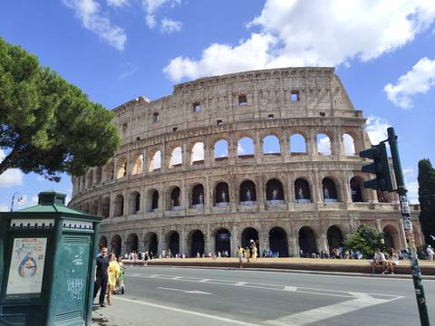       Colosseum in Rome with people walking nearby
  