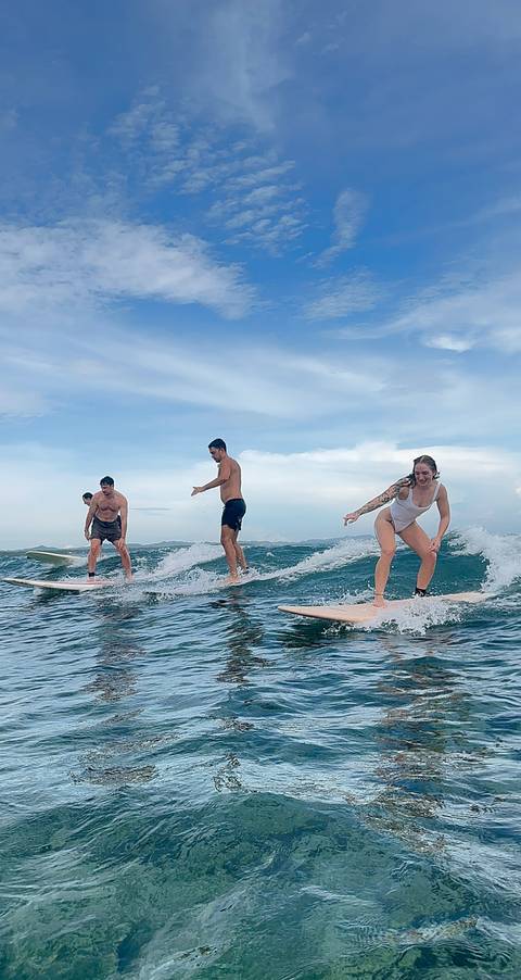 Group of people surfing on waves.