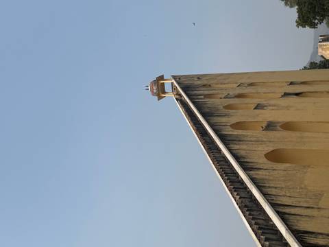 A steep staircase with a watch platform at the top.