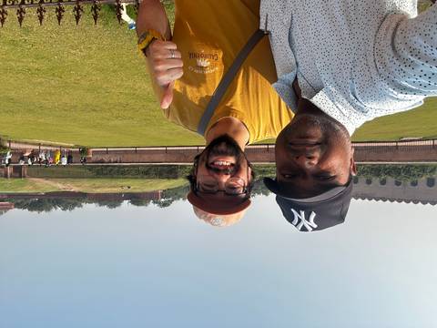 Two people taking a selfie in a park.