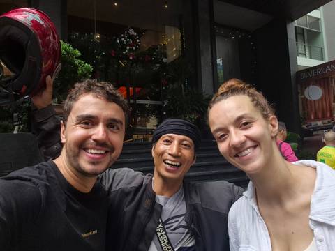       A selfie of three people smiling.
  