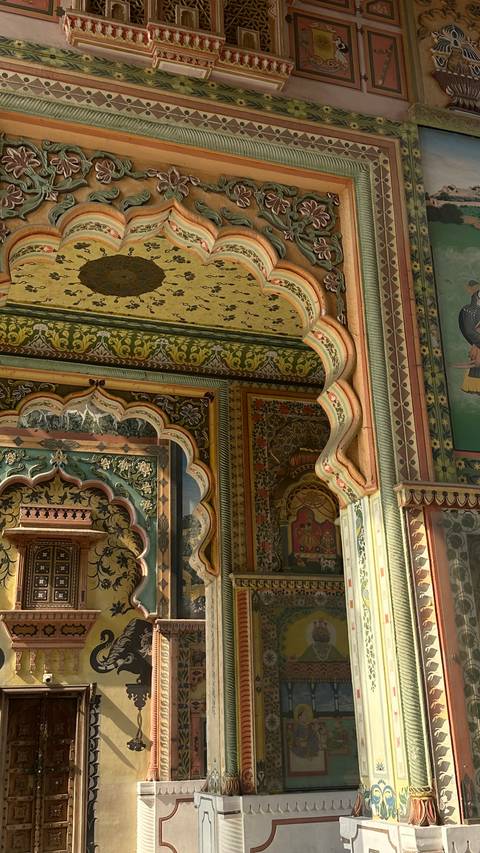 Ornate architectural details with colorful patterns and intricate carvings.