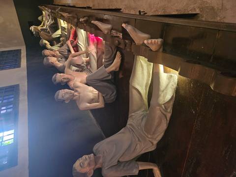 Sculptures of prisoners in a historical site.