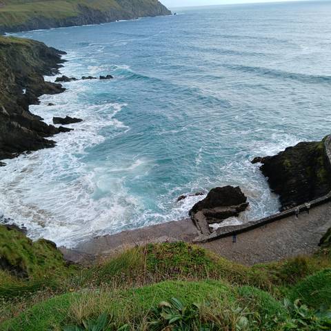 Waves crashing against a rocky coastline.
