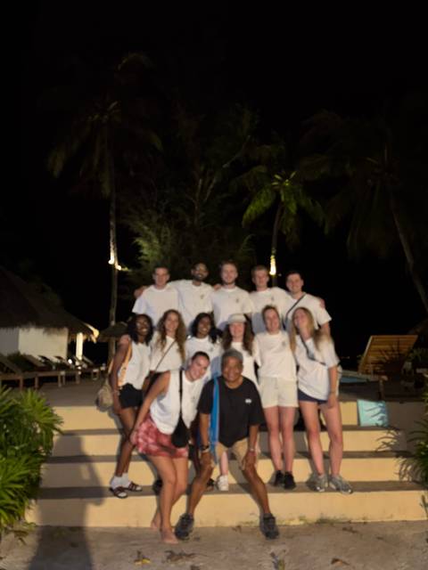 Group photo at night but blurry.