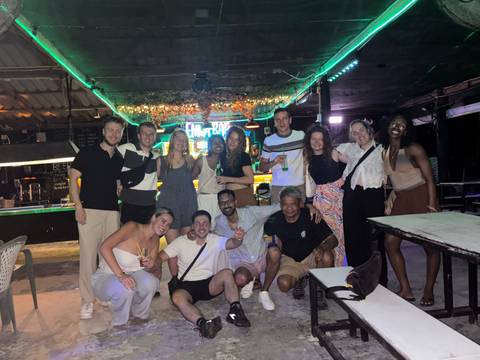 Group of people enjoying a night out at a bar.