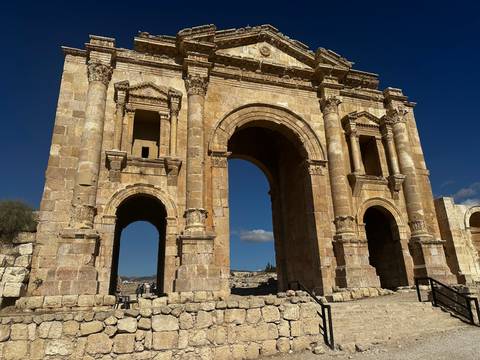 A large stone archway in ancient ruins.