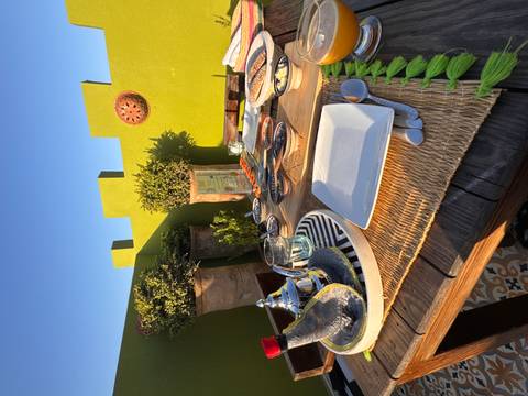 Dining setup with traditional Moroccan dishes.