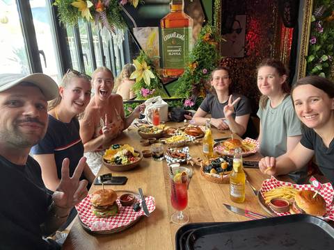 Group enjoying a meal together at a restaurant.