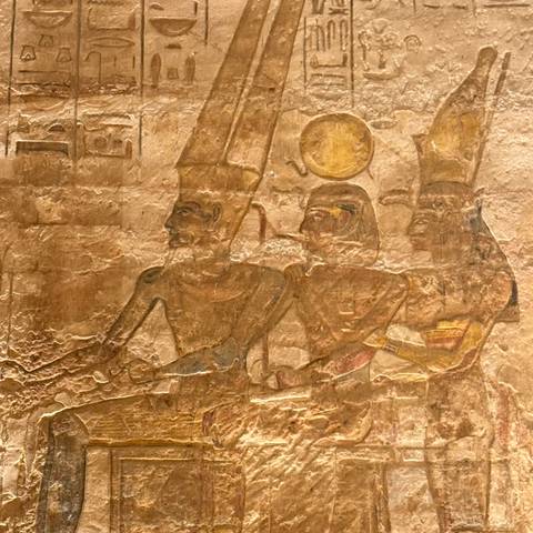 Ancient Egyptian wall carvings of historical figures.