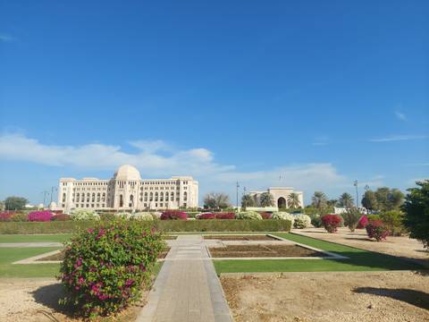       Modern building with a well-maintained garden.
  