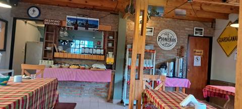 Interior of a rustic dining area with a breakfast setup