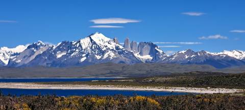 View of Torres del Paine mountain range with a lake in foreground