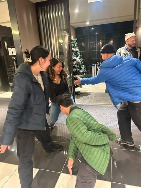 Friends playing around in a modern indoor space.