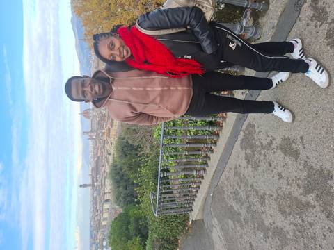 Couple posing with a panoramic view of Florence in the background.