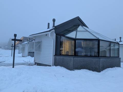 Modern igloo-style cabins with snowy surroundings.