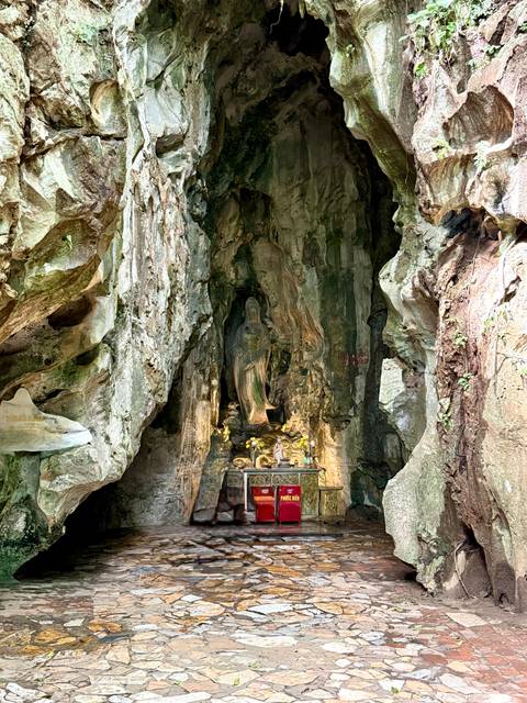       Ancient shrine within a rocky cave.
  