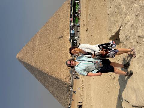 Two women posing in front of the Great Pyramid.