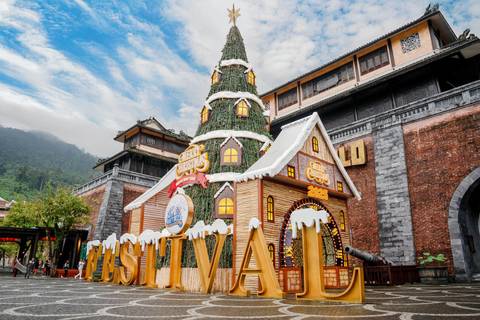       Festive building with a large sign in front, resembling a Christmas theme.
  