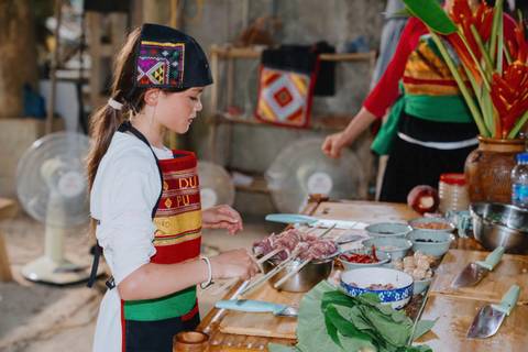       Girl cooking with fresh ingredients on a wooden table.
  