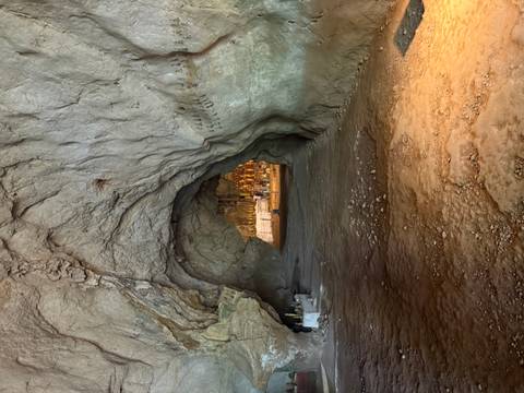 Cave interior with natural rock formations.