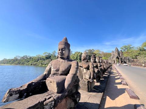 Bridge guarded by stone statues near Siem Reap.
