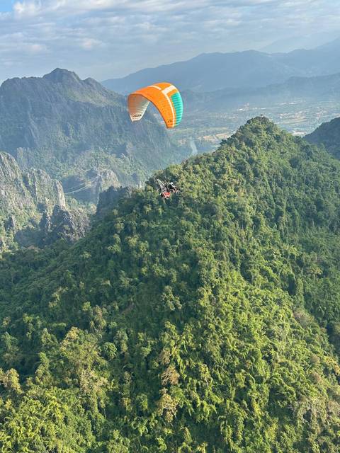       Dense forest with visible high-altitude structures.
  