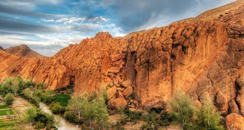 Scenic view of a canyon with a lush river valley.