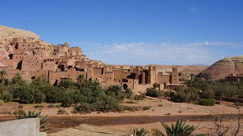       View of Ait Benhaddou under a clear blue sky.
  