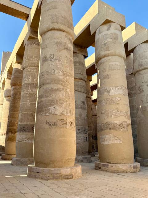       Massive columns with hieroglyphics at an ancient Egyptian site.
  