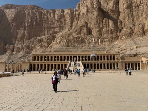       A large temple carved into a cliff face.
  