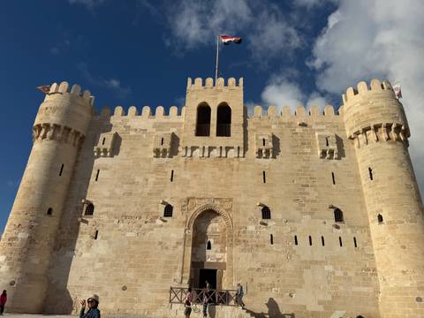       Citadel with towers and a clear blue sky.
  