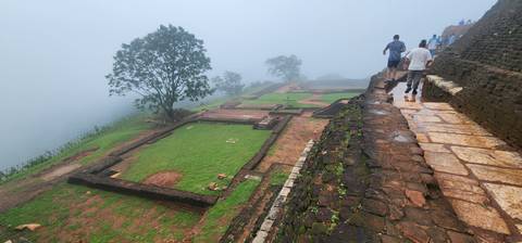 Foggy view of a historical site with stairs and ruins