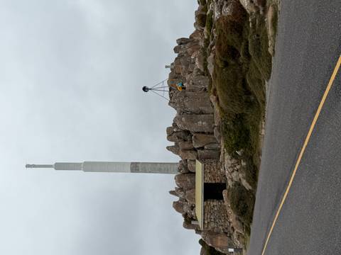 Large structure with tall mast, possibly an observation area.