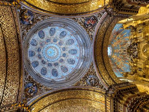 Intricate historic dome with golden and blue detailing.