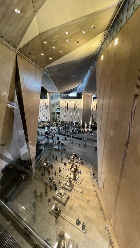 Modern museum interior with people inside.