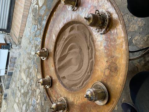       Traditional Turkish coffee setup with sand.
  