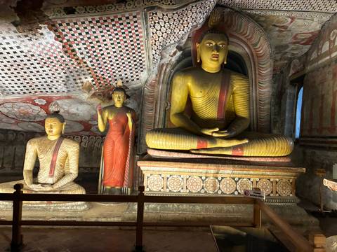 Colorful interior of a temple with statues.