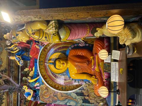 Brightly colored statues inside a temple.