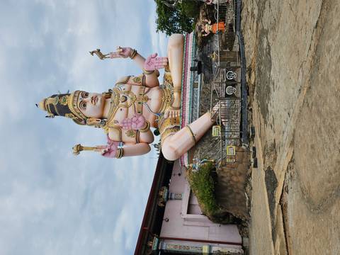 Large colorful Hindu statue with intricate details.