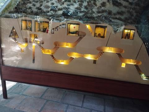       A diorama of a subterranean structure with various levels.
  