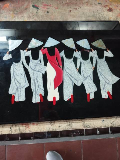       Artwork showing a row of figures in traditional dress.
  