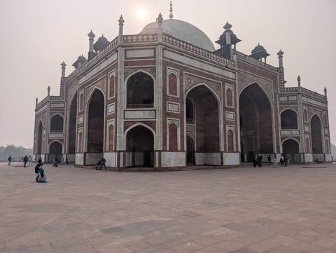 Historic red sandstone building with intricate architectural details.