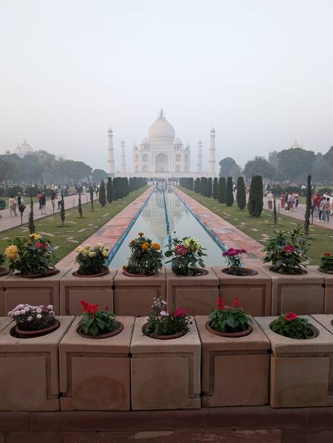 Floral arrangements in front of the iconic Taj Mahal.