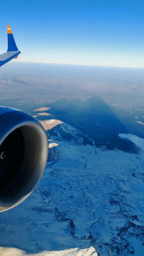 Aerial view of snowy mountains from an airplane.