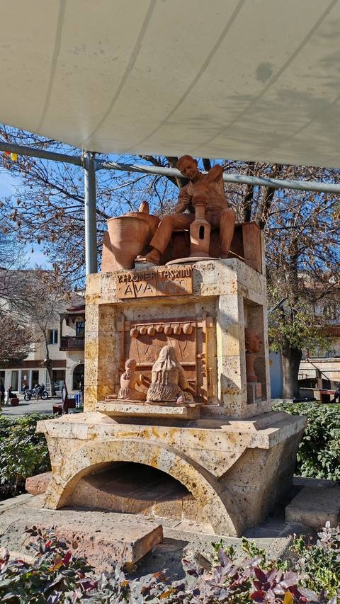 Statue in Avanos showing traditional pottery and weaving.