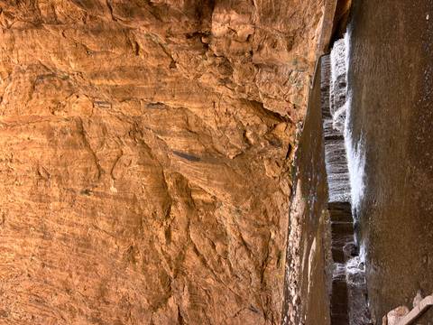       Small waterfall in a rocky gorge.
  