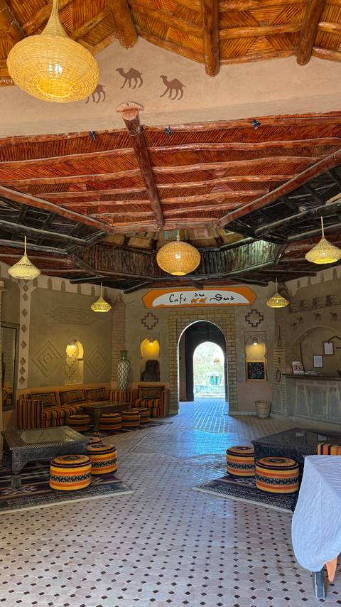       Interior of a café with traditional Moroccan decor.
  